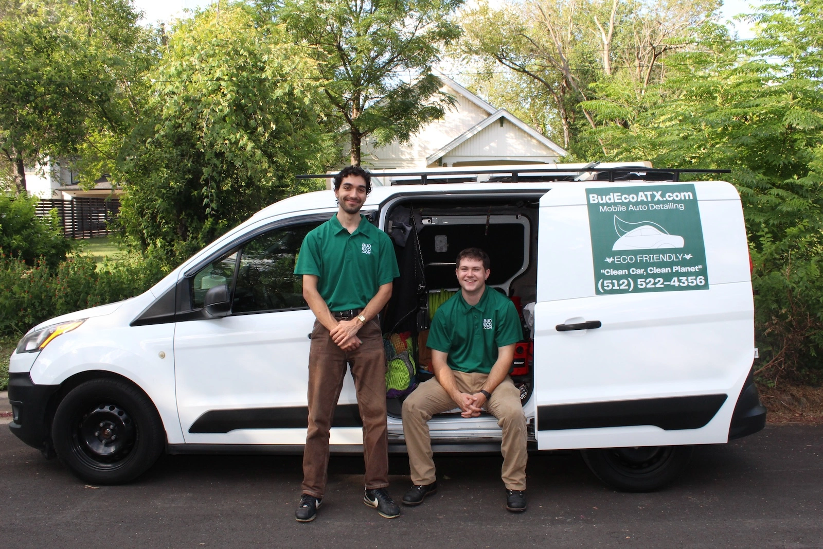 Beck and Umar standing in front of mobile detailing van