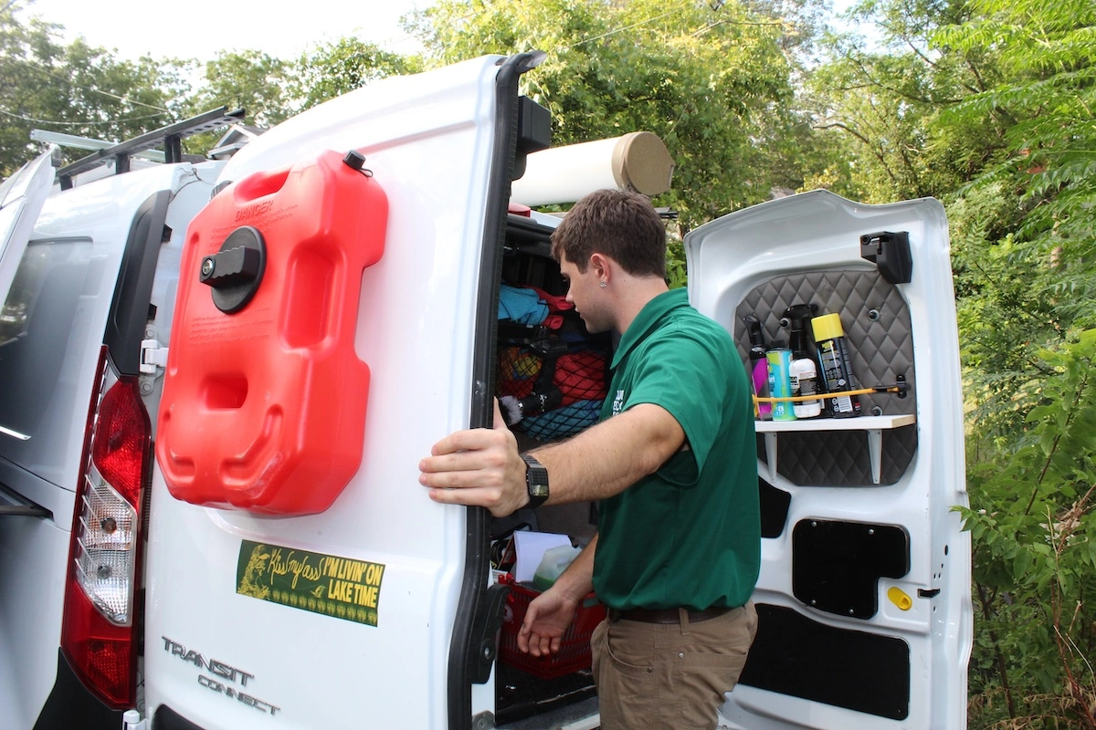 Man opening detailing van with detailing equipment