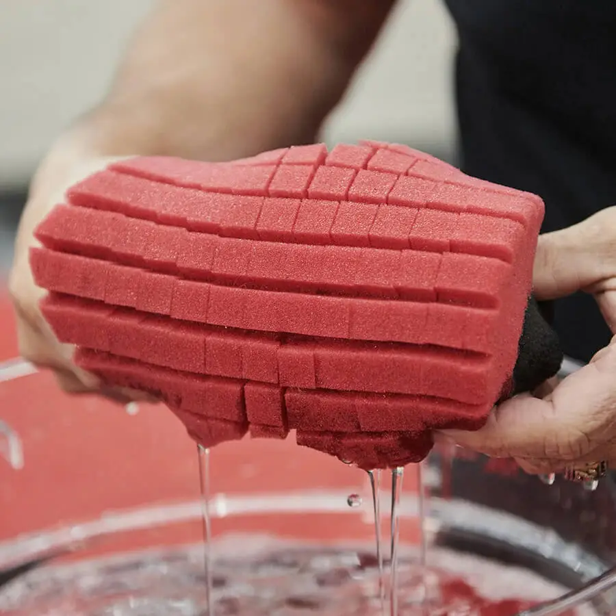 Showcasing the special design of a rinseless sponge for auto detailing