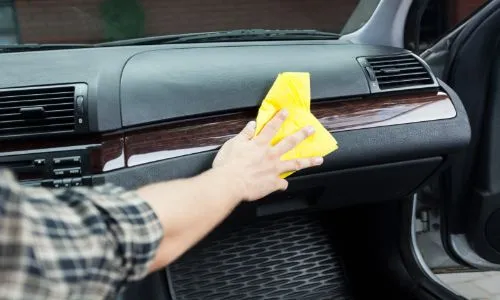 Wiping down interior with microfiber towel